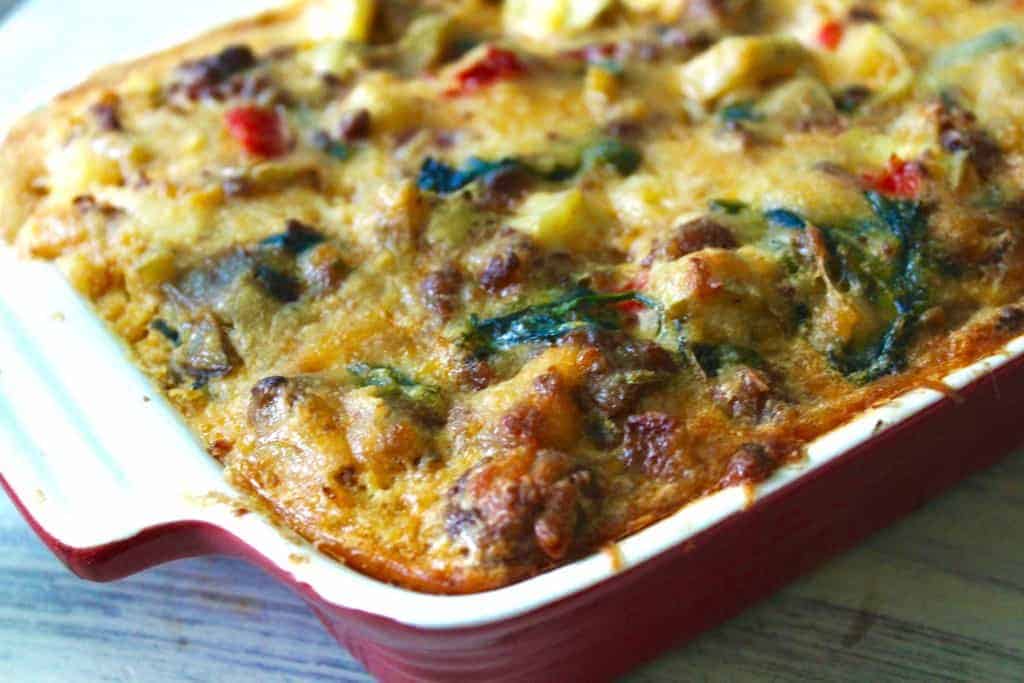 a baking dish of everything but the ktichen sink breakfast casserole is a great way to use up leftovers in your fridge and cook a whole30 breakfast