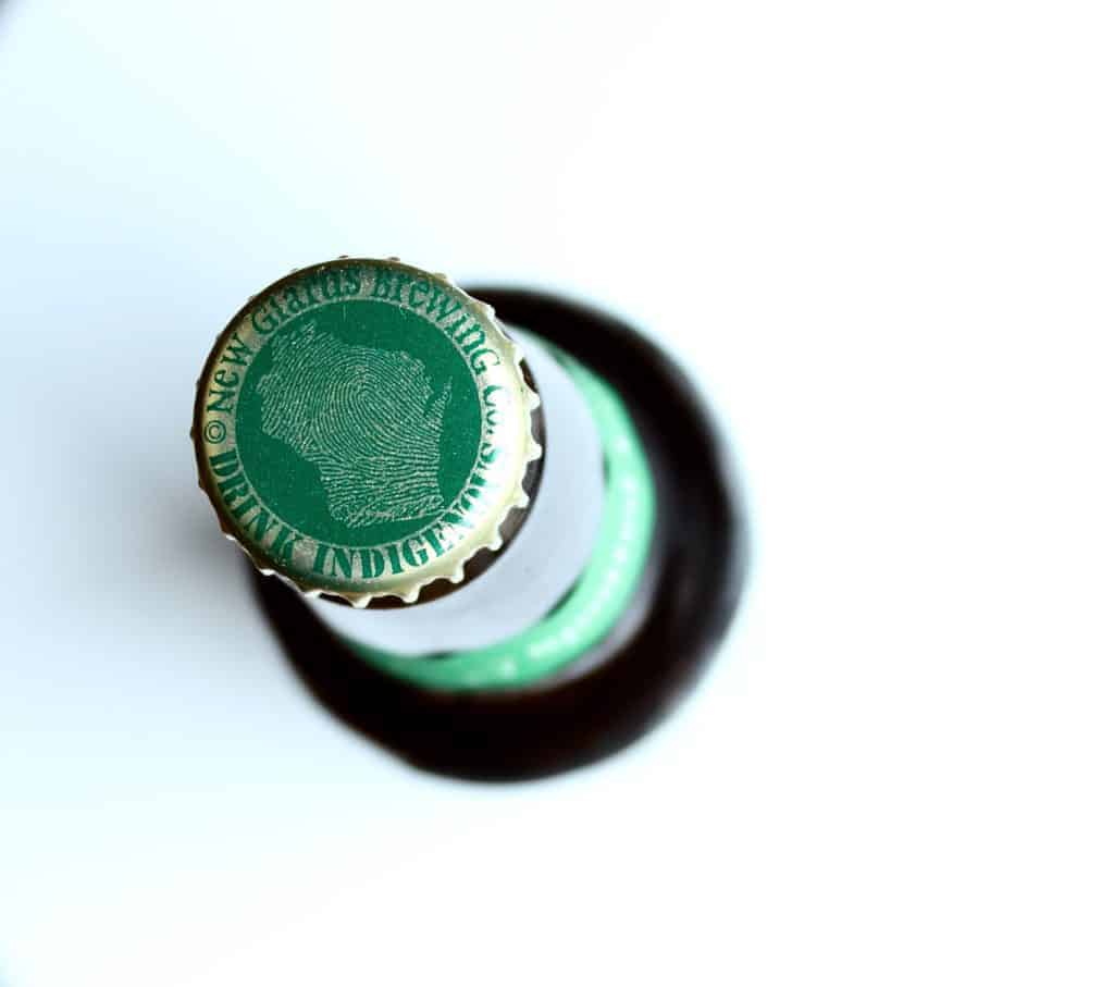 the cap of a bottle of new glarus spotted cow beer