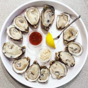 a dozen of raw oysters outer banks travel guide