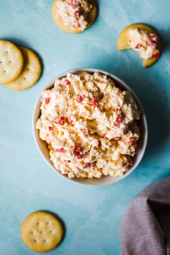 cheese in a white bowl on a blue background