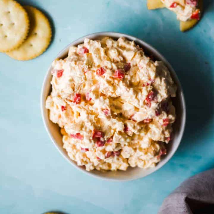 cheese in a white bowl on a blue background