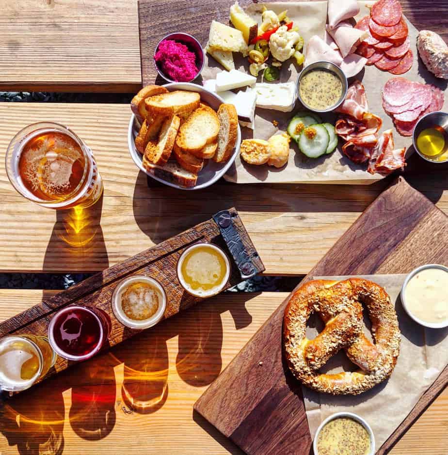 cheese board, flights and pints on town brewing's patio in charlotte