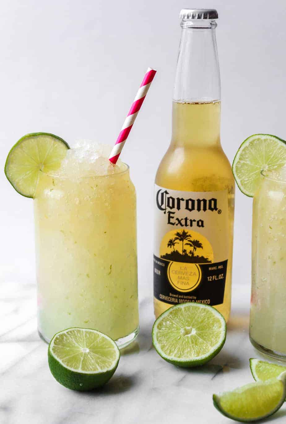 bottle of corona with limes and corona cocktail