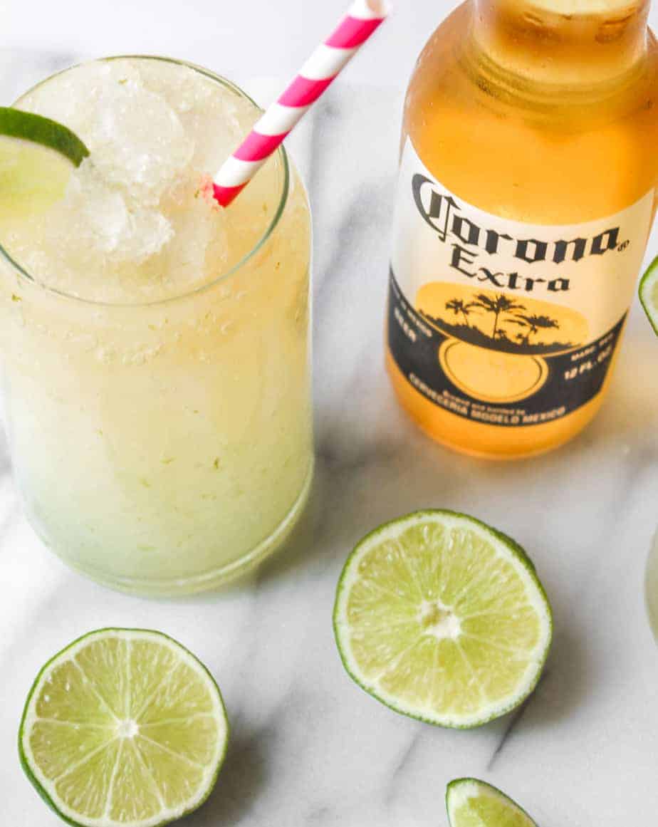 bottle of corona extra with limes