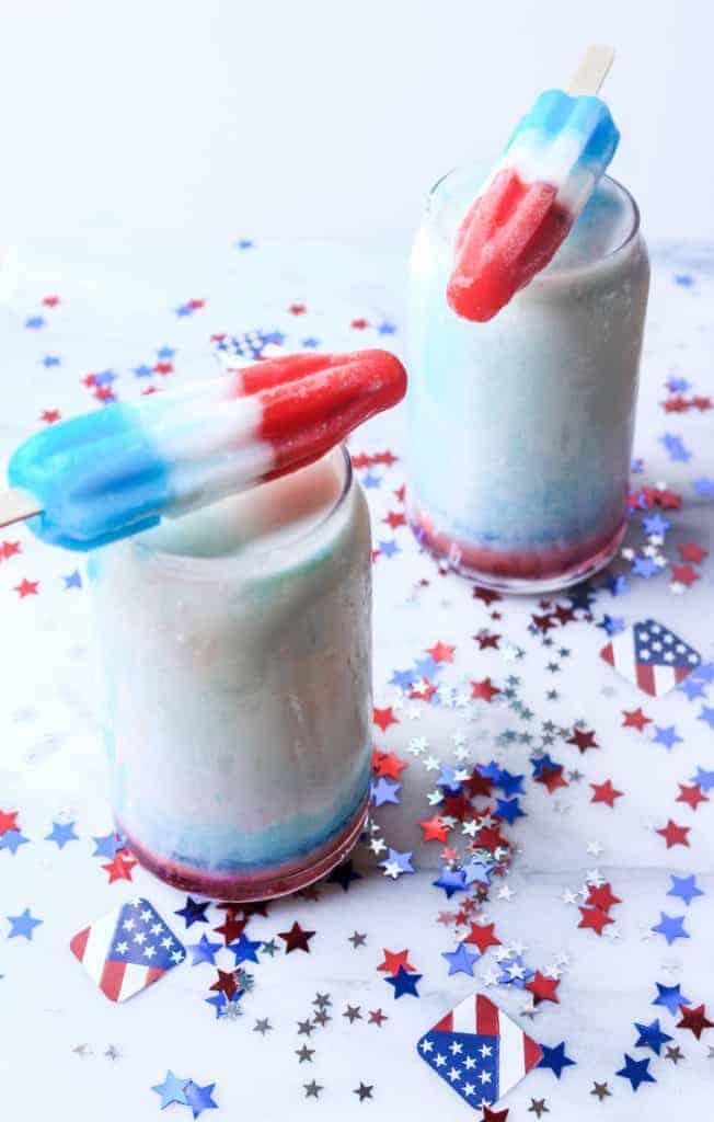 overhead shot of red white and blue firecracker popsicles and red white and blue confetti