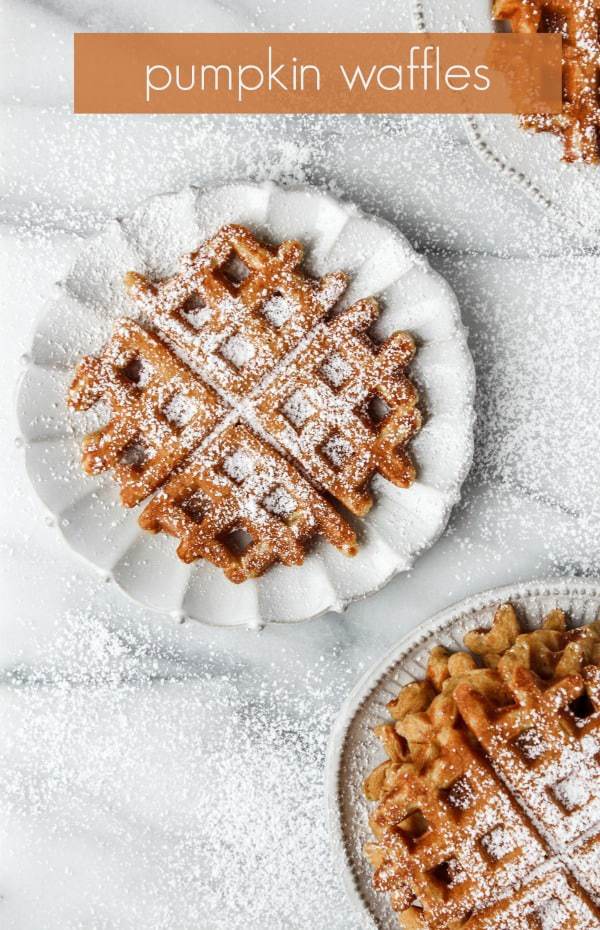 no shame in our pumpkin flavored everything game! No need to buy frozen waffles when you can easily make the real thing at home! these pumpkin waffles, from The Ultimate Kids' Cookbook, are full of fall flavors and so easy to make they've become a seasonal Sunday morning staple in our house. this fall recipe is the perfect breakfast recipe or brunch recipe, and is such an easy recipe they feature just a few pantry staple ingredients and just one bowl!