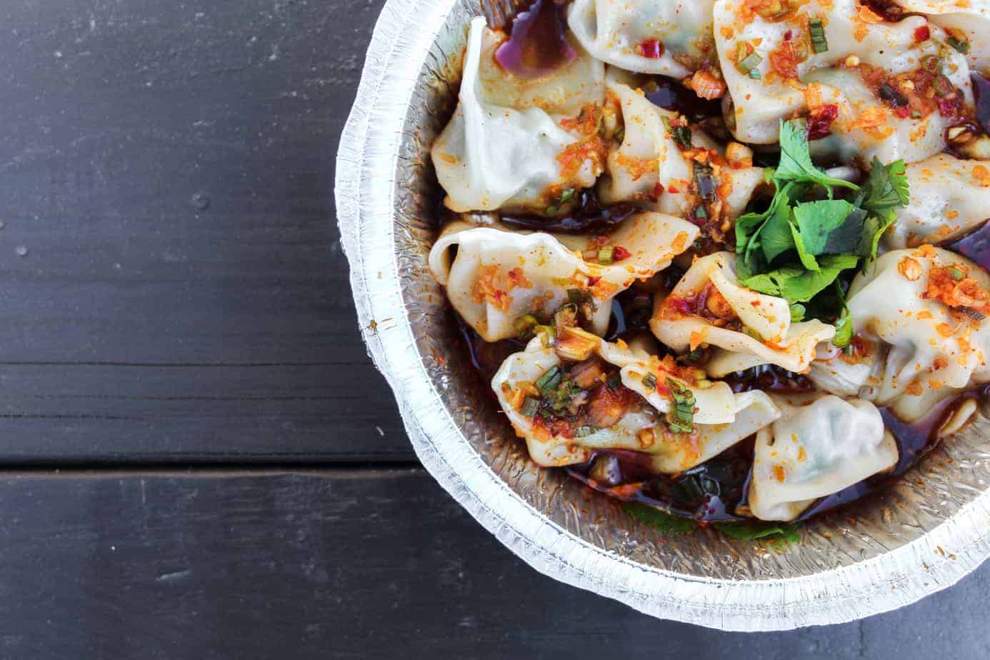 pork and chive dumplings from the dumpling lady on a picnic table