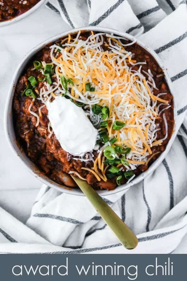 my mom's award winning chili recipe is one of the best comfort food meals! it's so easy to make just using one pot, and has tons of yummy flavors with the addition of bacon and pinto beans. you can add as much chili powder as you want to make it as spicy as you like! plus, the post includes tips on how to use up the leftovers and how to freeze!