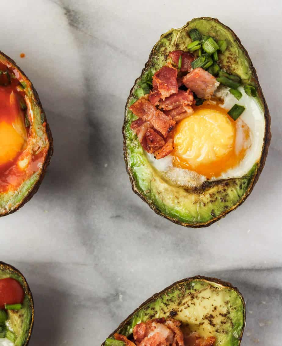 easy whole30 breakfast baked eggs in avocados with chives and bacon