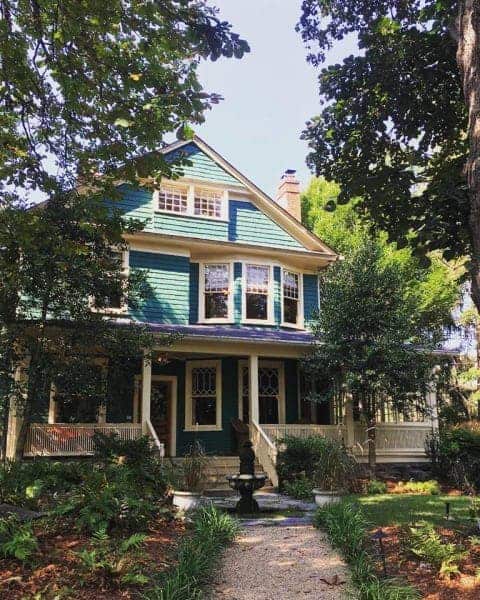 the painted green front of at cumberland an asheville bed and breakfast