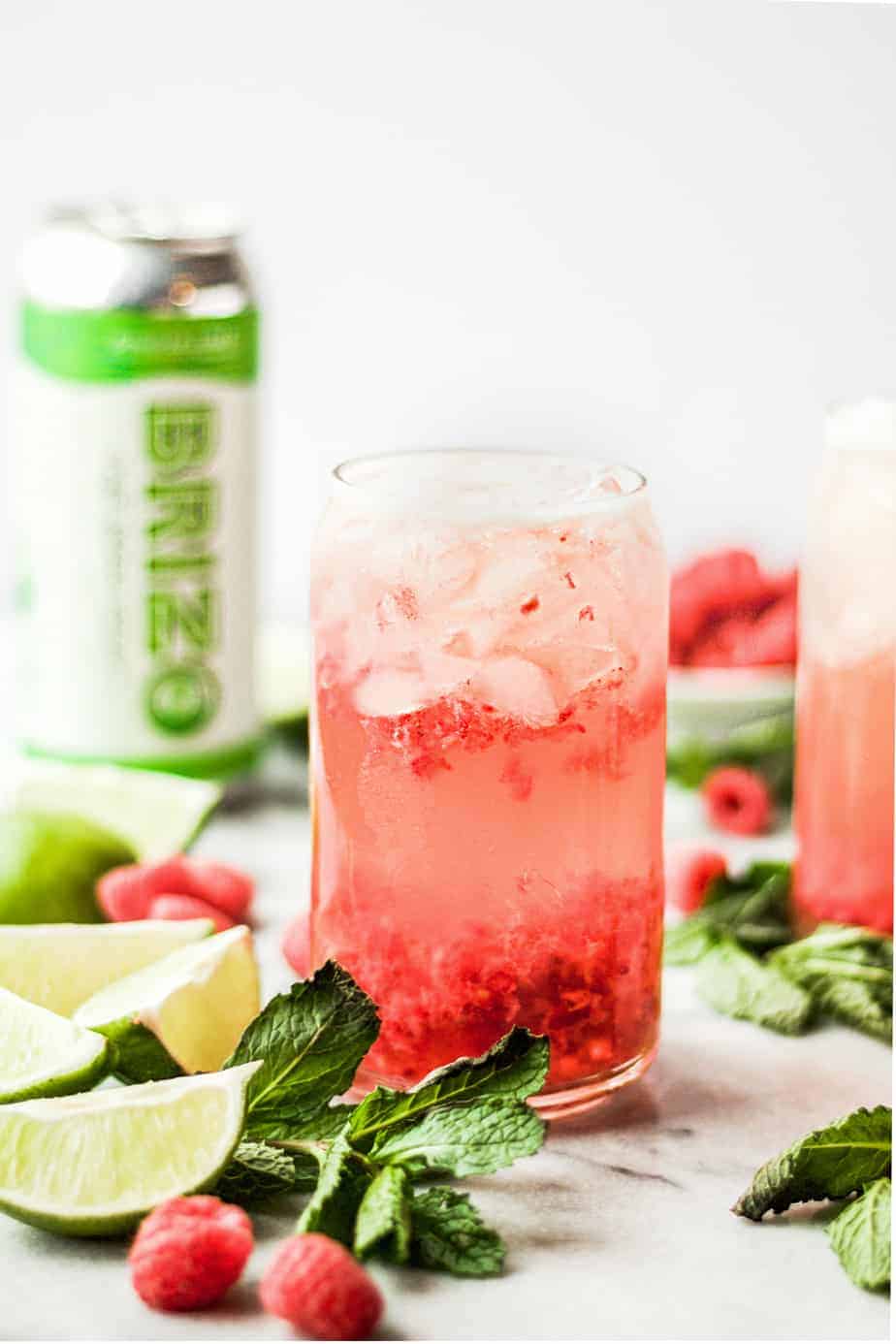 raspberry gin seltzer cocktail with noda brizo ginger lime can