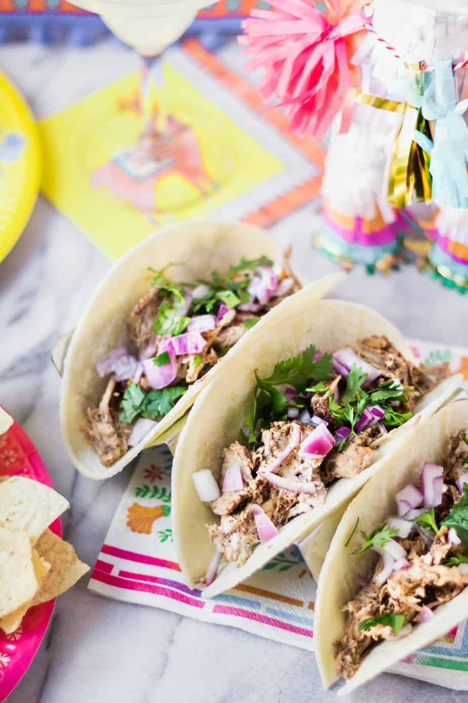 taco bar party pork tacos with onion and cilantro