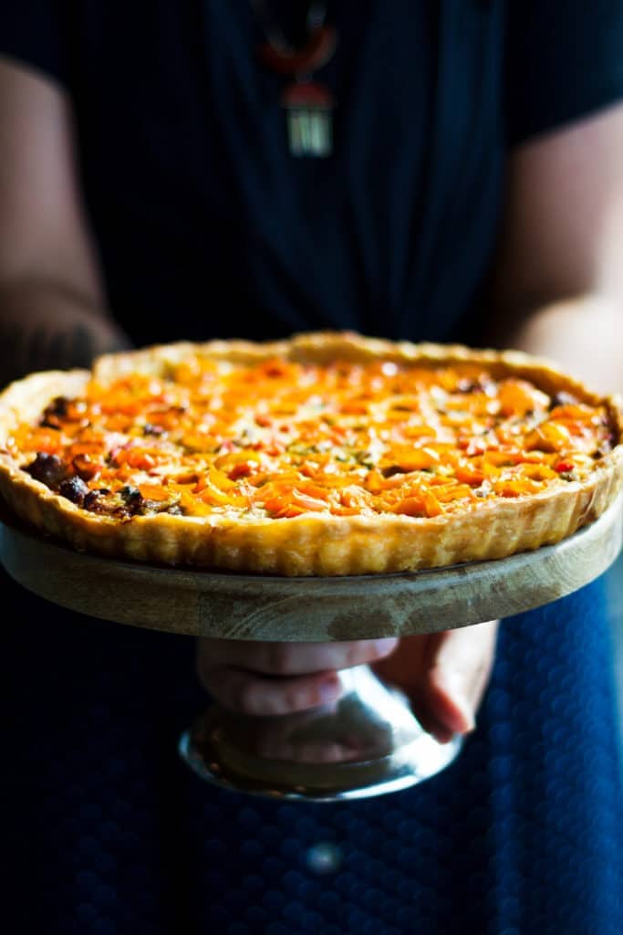 chef joe kindred tomato pie on a cake stand