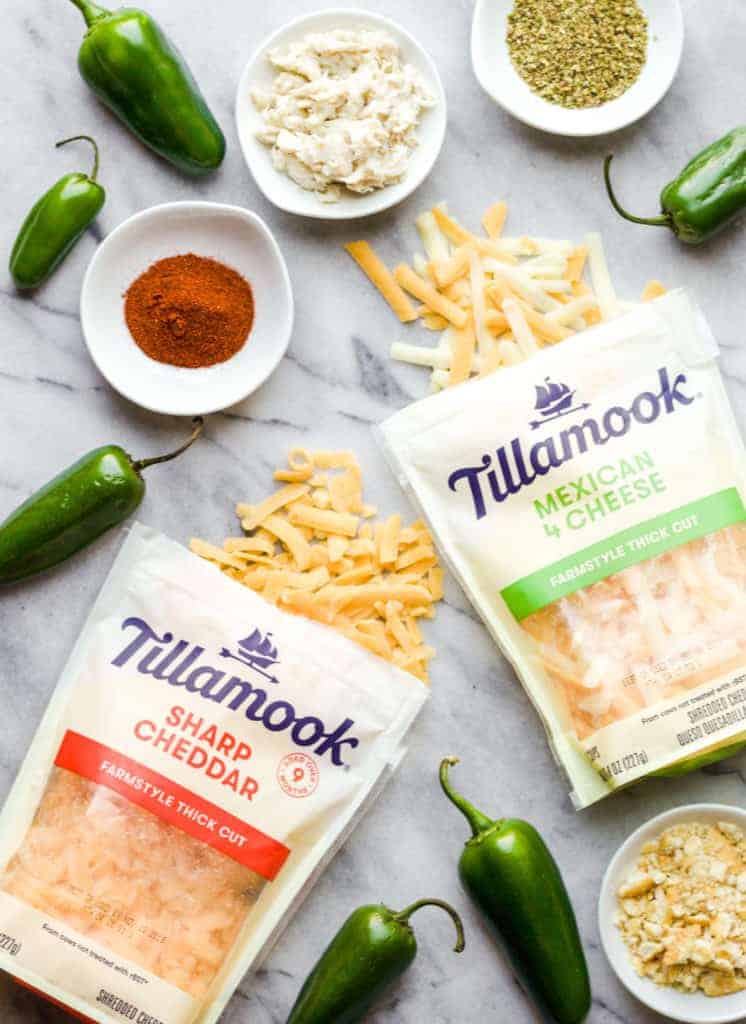 ingredients to make crab stuffed baked jalapeno poppers on a marble board