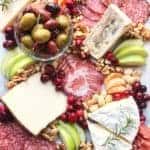 a variety of cheeses on a board how to create a cheese platter