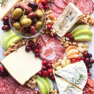 a variety of cheeses on a board how to create a cheese platter