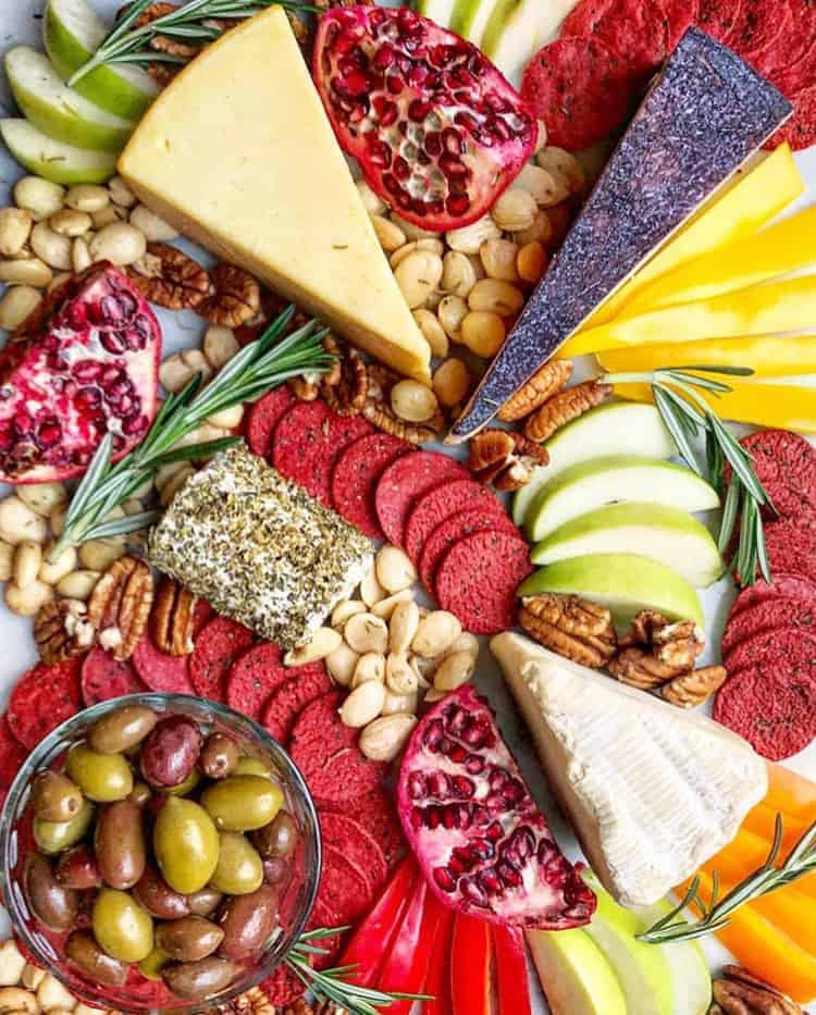 how to make a cheese platter with brightly colored cheese crackers and fruit