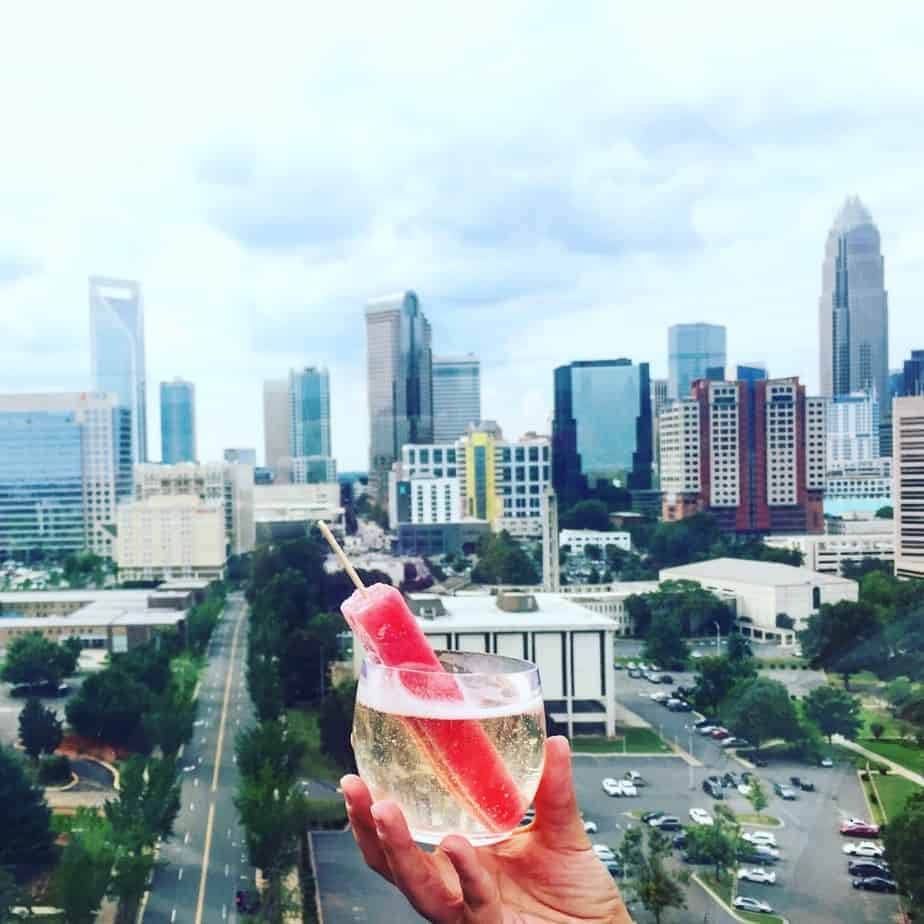 a popsicle cocktail with the charlotte nc skyline charlottes restaurant