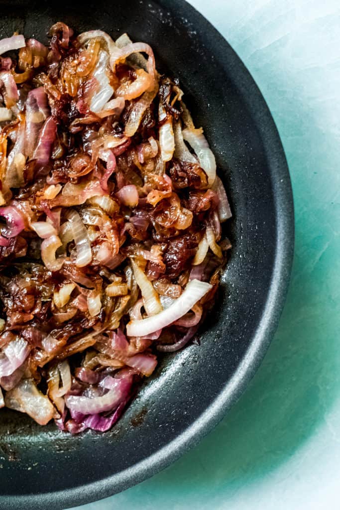 caramelized red onion in a black skillet