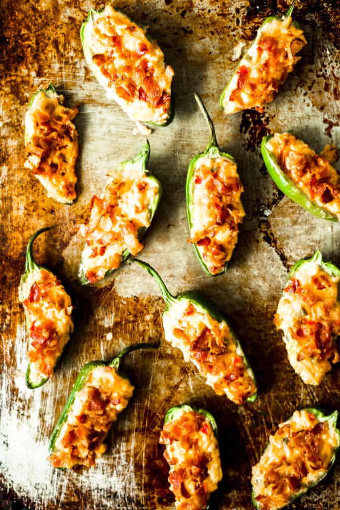 pimento cheese poppers lined up on a metal sheet tray