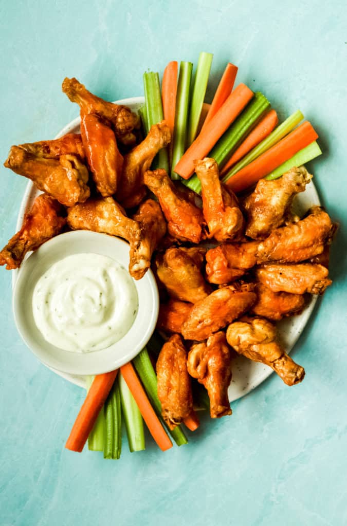 a big plate of buffalo wings, carrots, celery and ranch for dipping