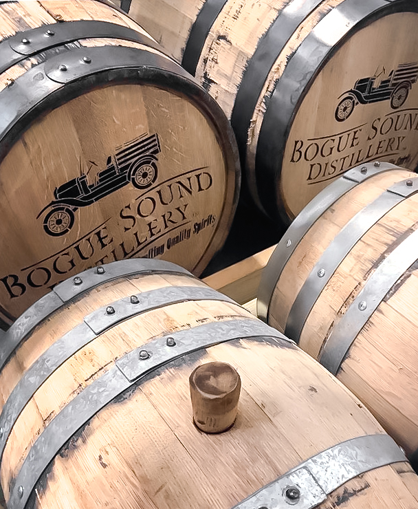 whiskey barrels with bogue sound distillery logo