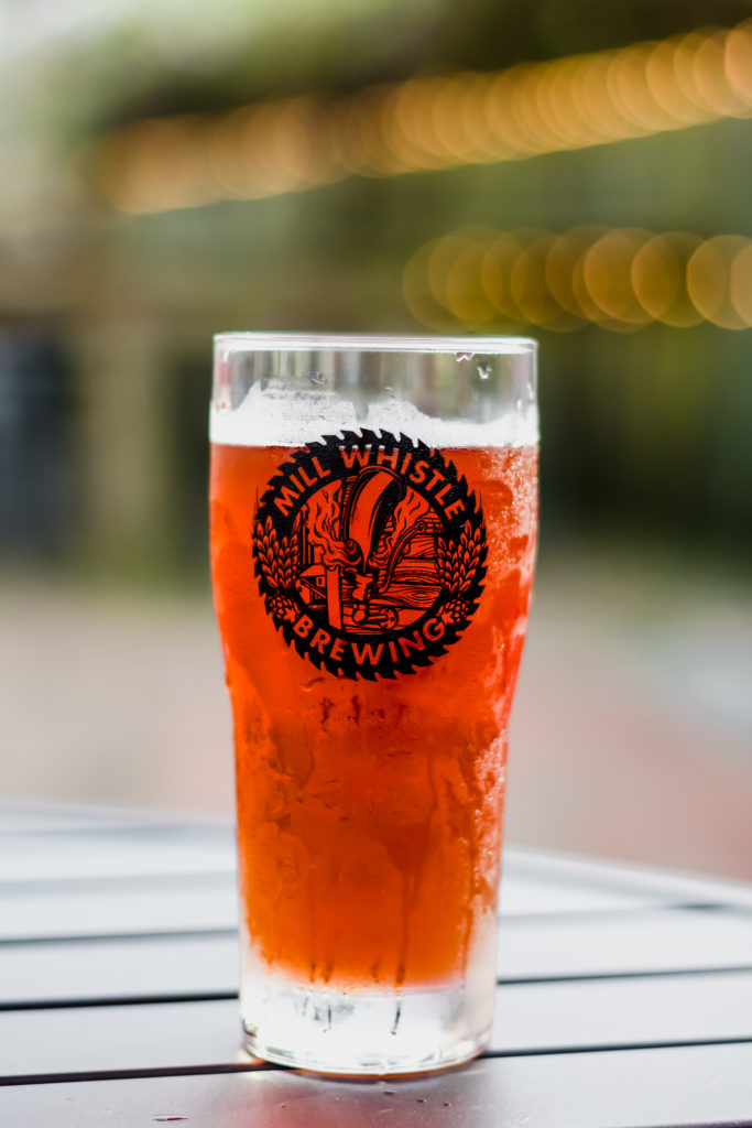 pint of beer on the patio of mill whistle brewing