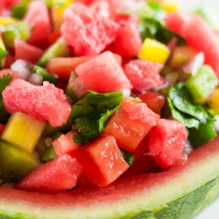 fresh homemade salsa with watermelon in a bowl made out of watermelon rind