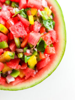 overhead shot of watermelon salsa on a white background