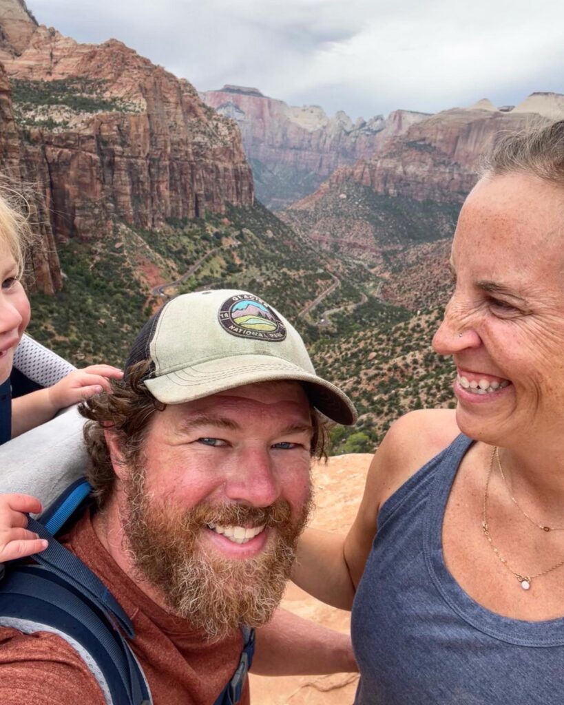 family selfie in front of zion canyon