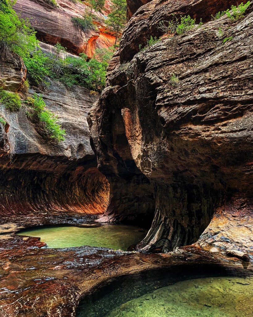 two pools of blue water in the subway slot canyon