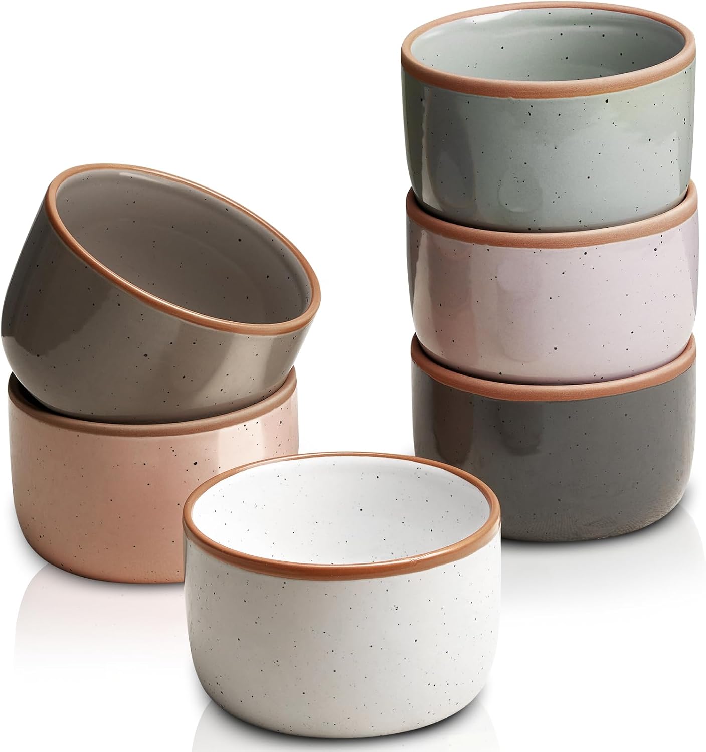 Six small ceramic bowls in muted pastel colors, including pink, gray, green, white, and taupe, are shown stacked in two columns and arranged on a white surface. The bowls have a speckled texture and brown rims.