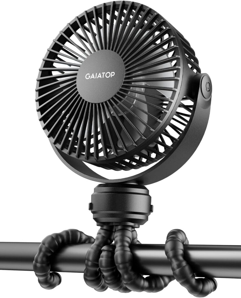 A black portable fan with the brand name Gaiatop is mounted on a bar using flexible, bendable tripod legs wrapped securely around the bar.
